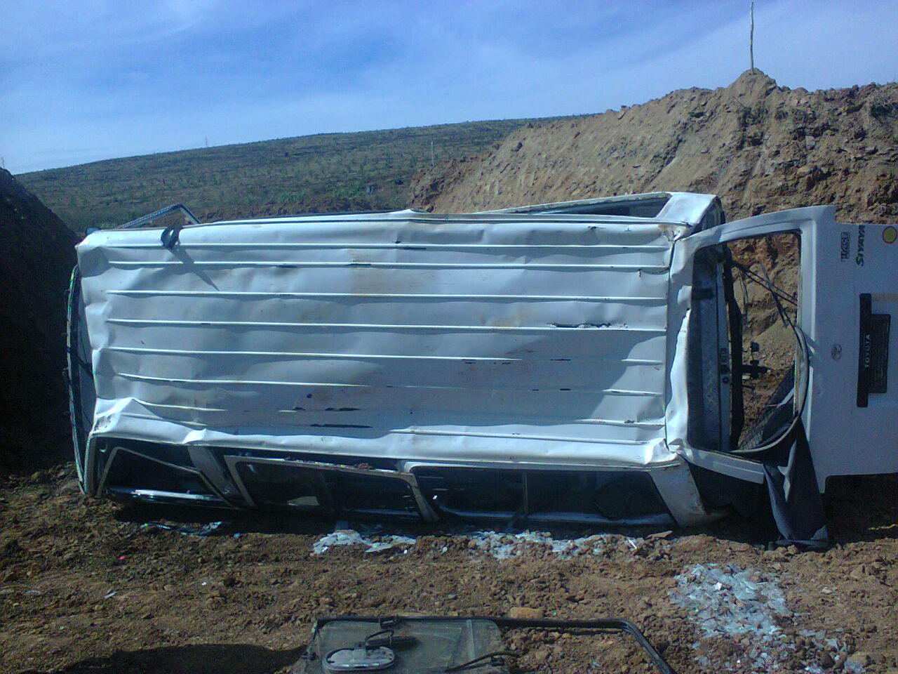 Twelve people have been injured when a minibus overturned on the R74