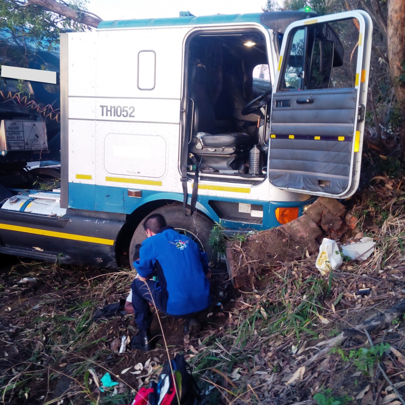 Out of control trucks hits pedestrian and pins him under the wheel