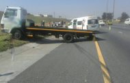 Three injured when taxi is rear-ended into flat bed truck in Alberton