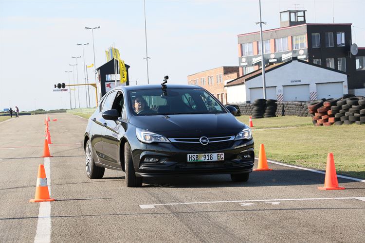 Yolanda Kotze, GMSA Global Compensation Consultant navigates the new Opel Astra through a set of cones at the Aldo Scribante Raceway.