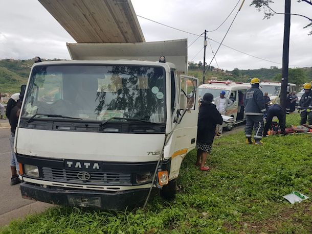 4 people injured after truck collides with light pole