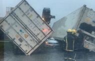 One killed and one injured after shipping containers fell on vehicle