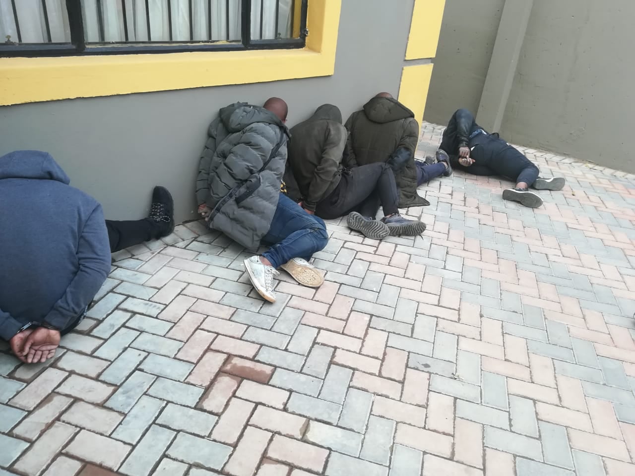 Police arrest six suspects and recover unlicensed firearms after robbery in Dragon City