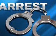 Murder suspect arrested with firearm
