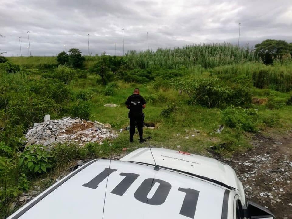 Severely burnt body of an unidentified man was discovered next to a bush along the M25