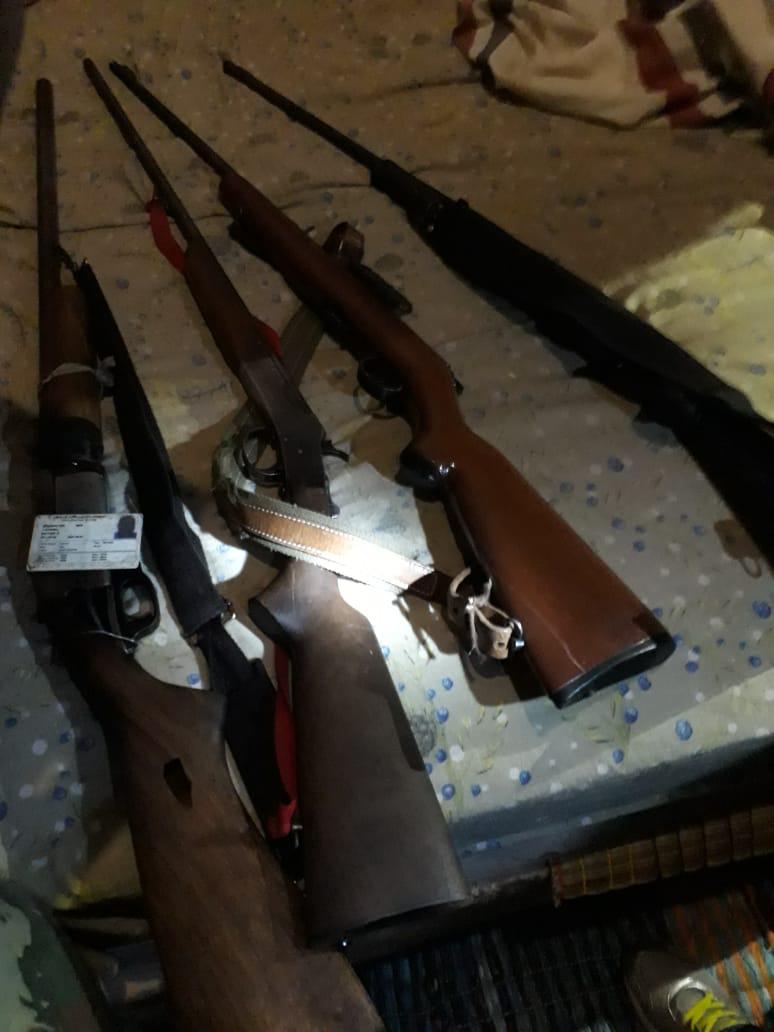 Members of the Rapid Rail Policing Unit seize four rifles, one pistol and 100 rounds of ammunition