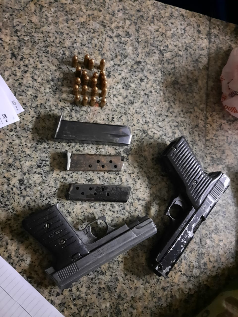Five pistols seized, three men in court