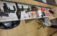 Suspect in custody following discovery of illegal firearms and stolen property