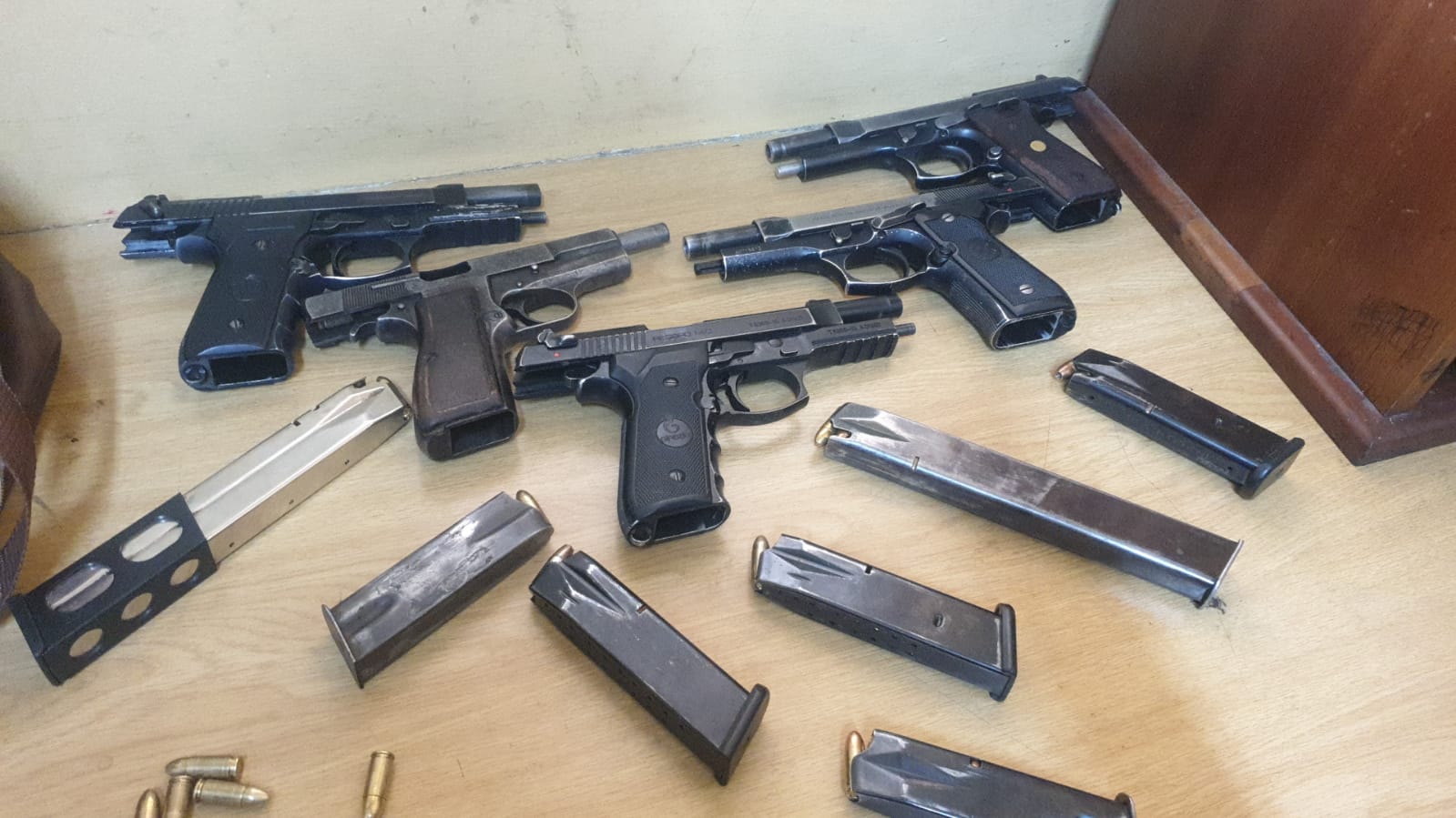 Five illegal firearms seized, nine suspects to appear in court