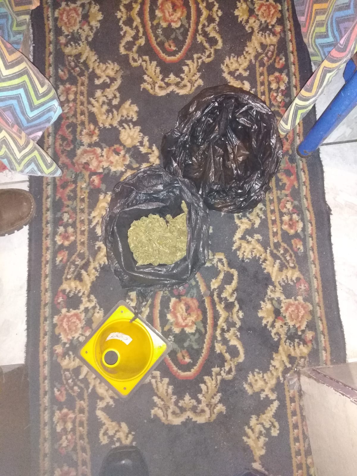 Police confiscate drugs and a firearm