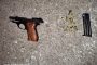 Murder suspect in court after being nabbed with a stolen firearm