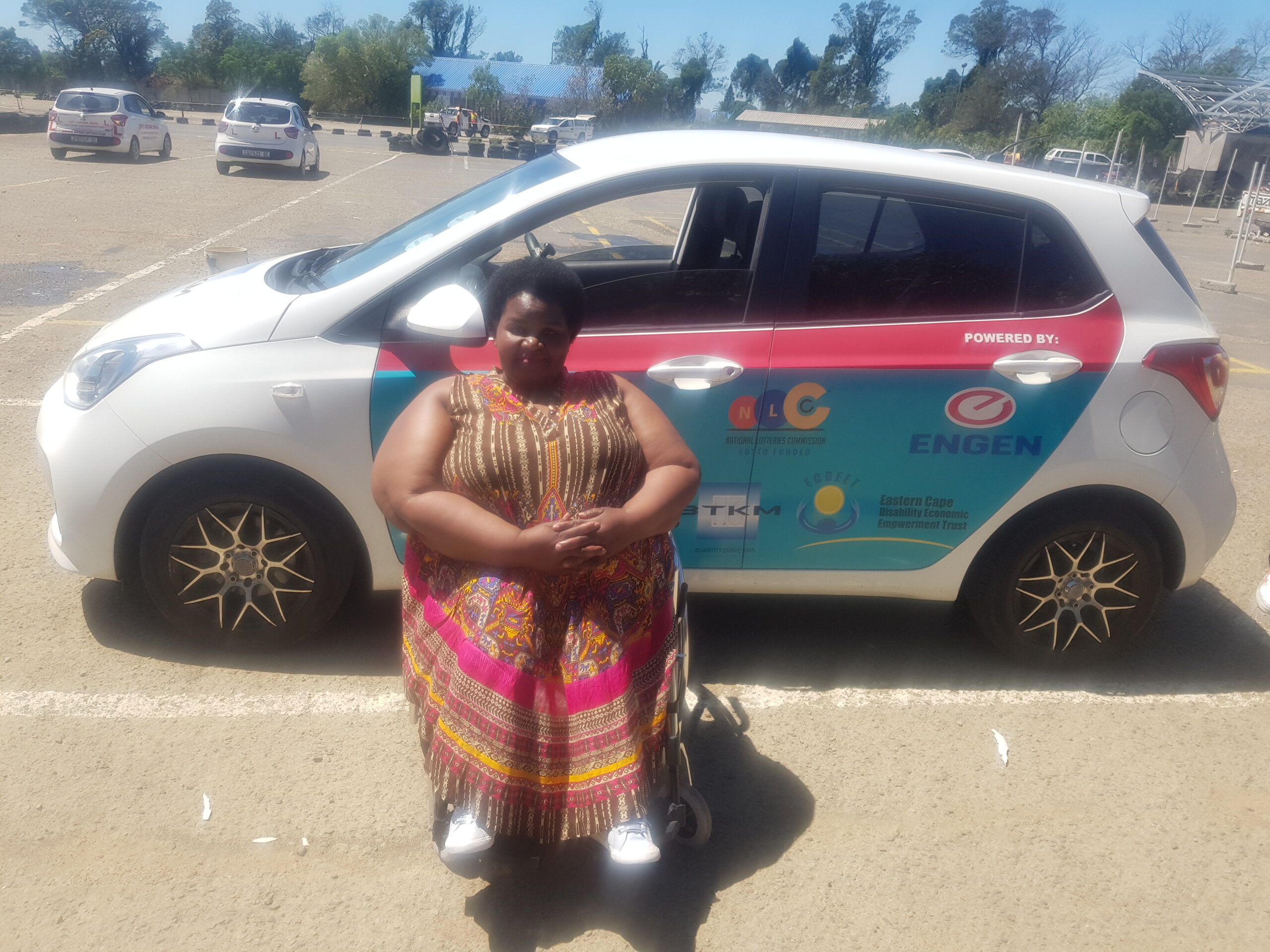 Engen helps Zininzi get behind the wheel