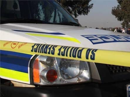 Suspect killed during business robbery whilst another was arrested, manhunt launched for third suspect.