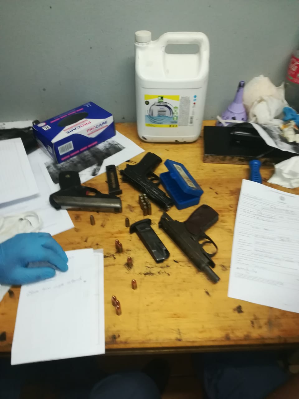 Police arrested three suspects and seized four unlicensed firearms and ammunition