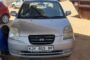 Arrests made after e-hailing taxi was dropping off a passenger when driver was attacked by five armed suspects.