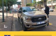 Metro Police officer issue a fine to a vehicle parked in a disabled parking bay and not having a visible motor license disc in Durban
