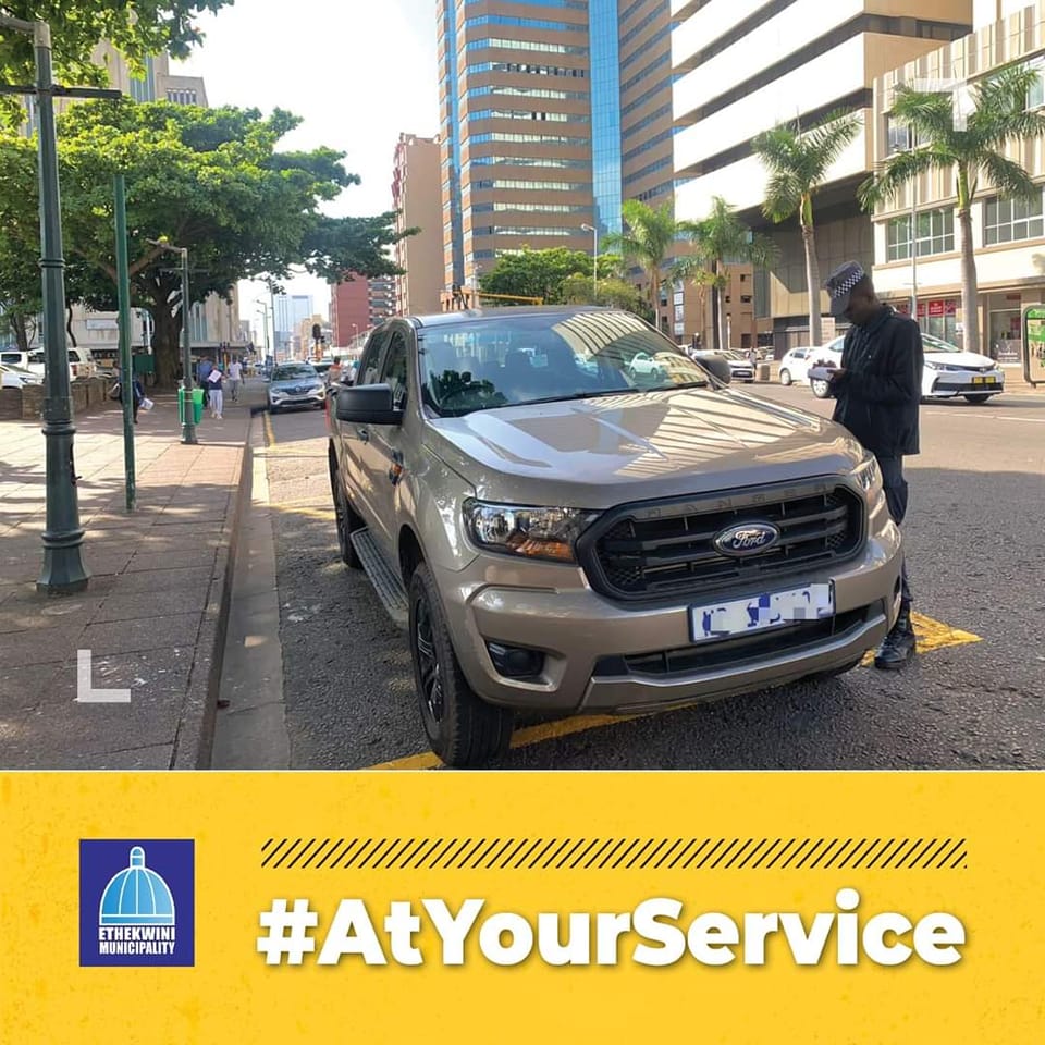 Metro Police officer issue a fine to a vehicle parked in a disabled parking bay and not having a visible motor license disc in Durban