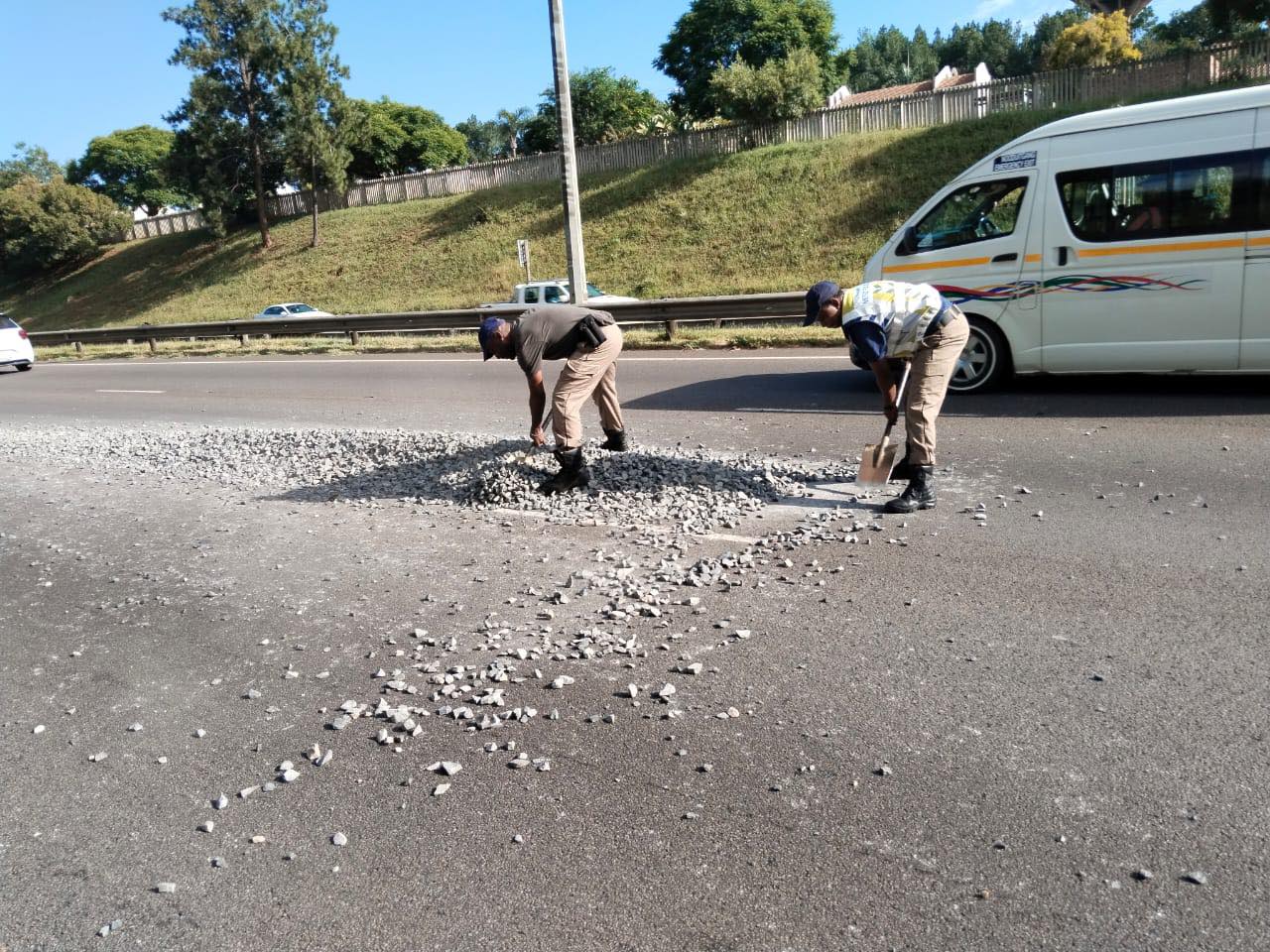 TMPD members assisting with cleaning the road on the N4 after a truck lost its load