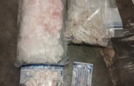 Suspects in court on charges of dealing in drugs and unlawful possession of firearms and ammunition