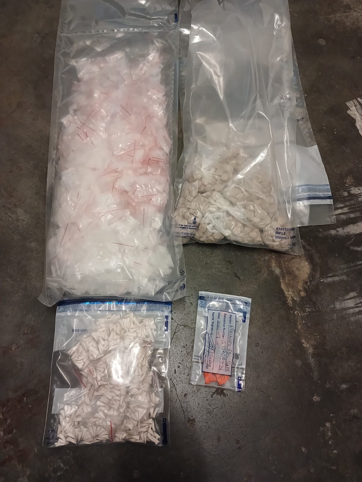 Suspects in court on charges of dealing in drugs and unlawful possession of firearms and ammunition