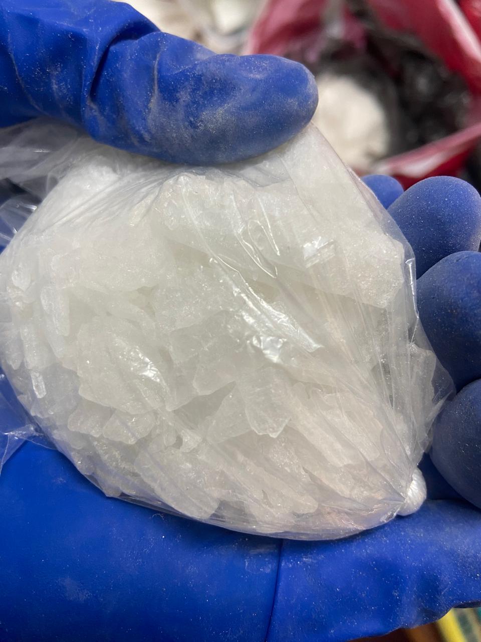 Members of Border police remove drugs during a follow-up visit at a drug house