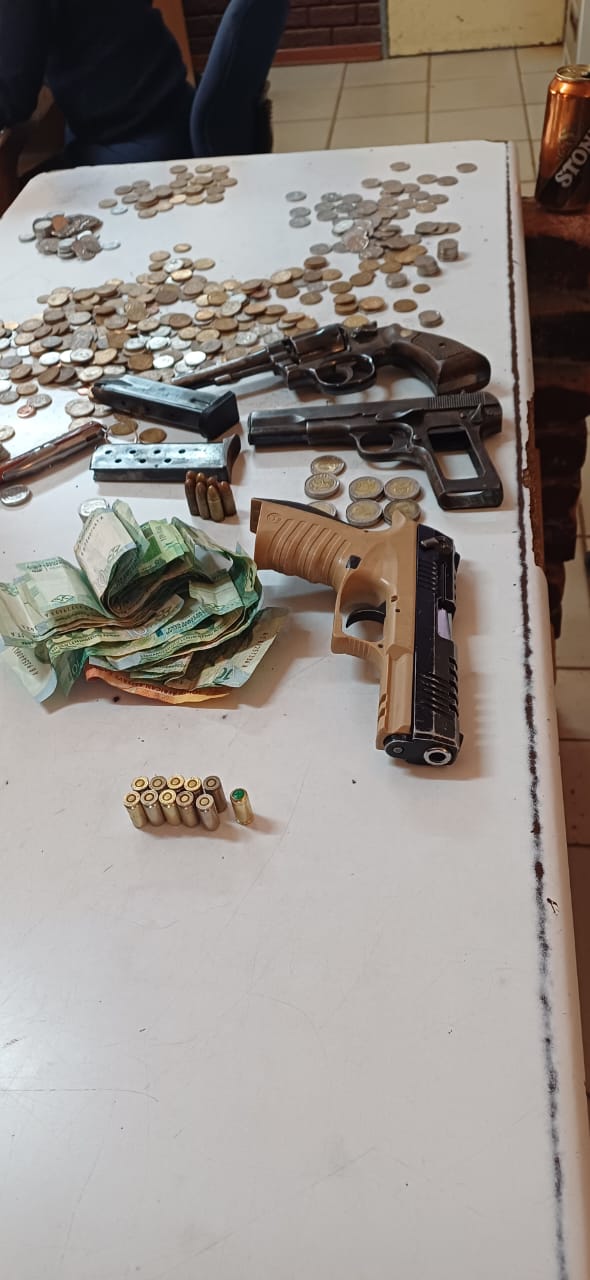 Police arrest three business robbery suspects and seize firearms