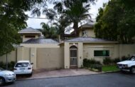 Police have arrested three men and a woman at the house of former President Nelson Mandela in Houghton