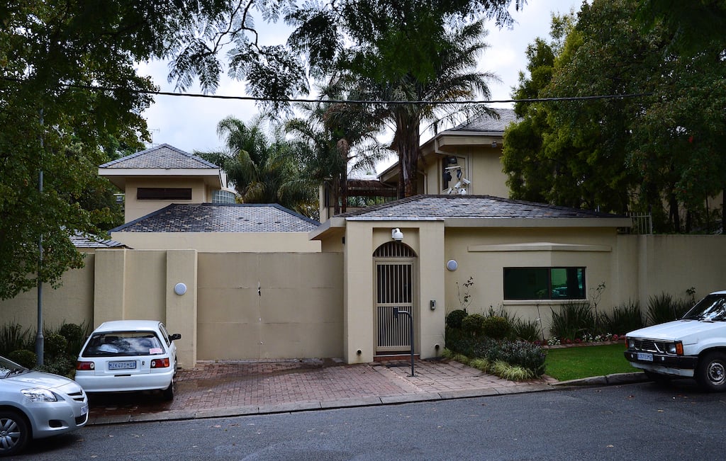 Police have arrested three men and a woman at the house of former President Nelson Mandela in Houghton