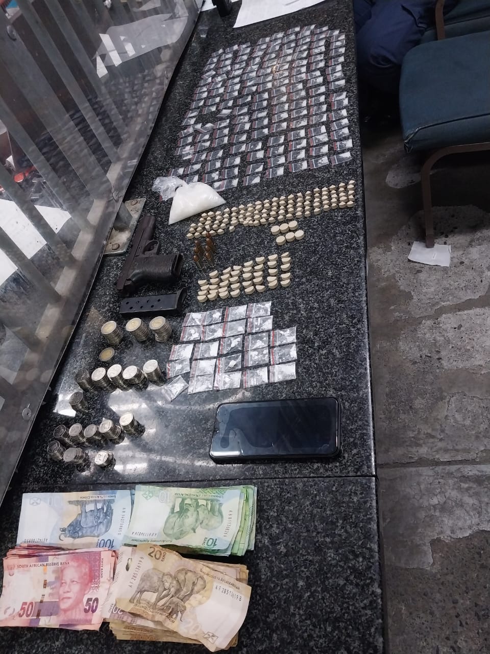 Suspect face possession of a prohibited firearm and drugs charges