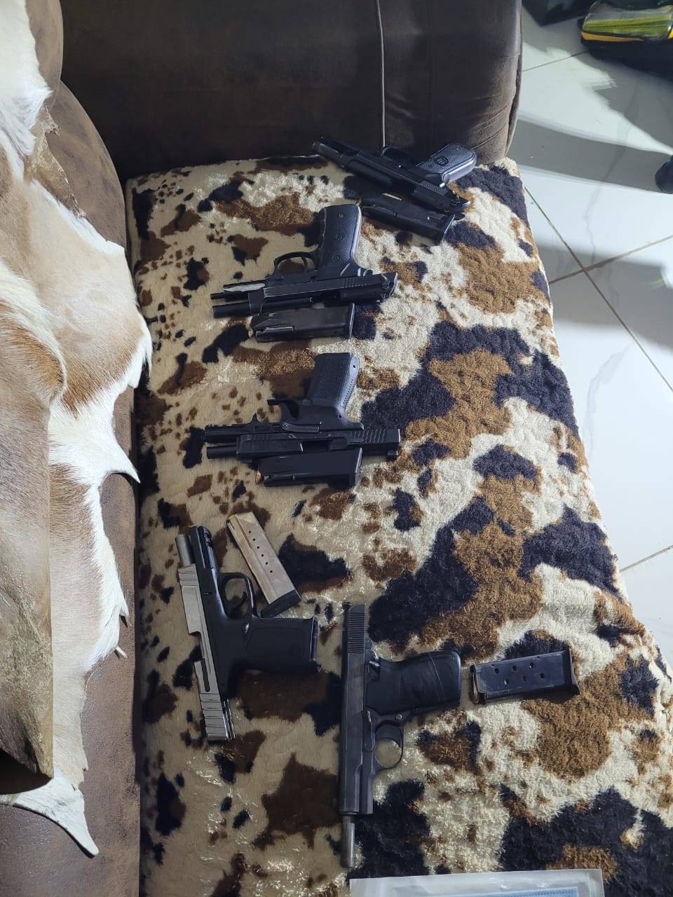 Five firearms recovered and two suspects arrested