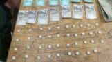 Male suspect found dealing in substances suspected to be drugs