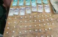 Male suspect found dealing in substances suspected to be drugs
