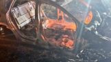 Burned-down shell of a grey VW Polo found on Chris Hani Rd in Pimville