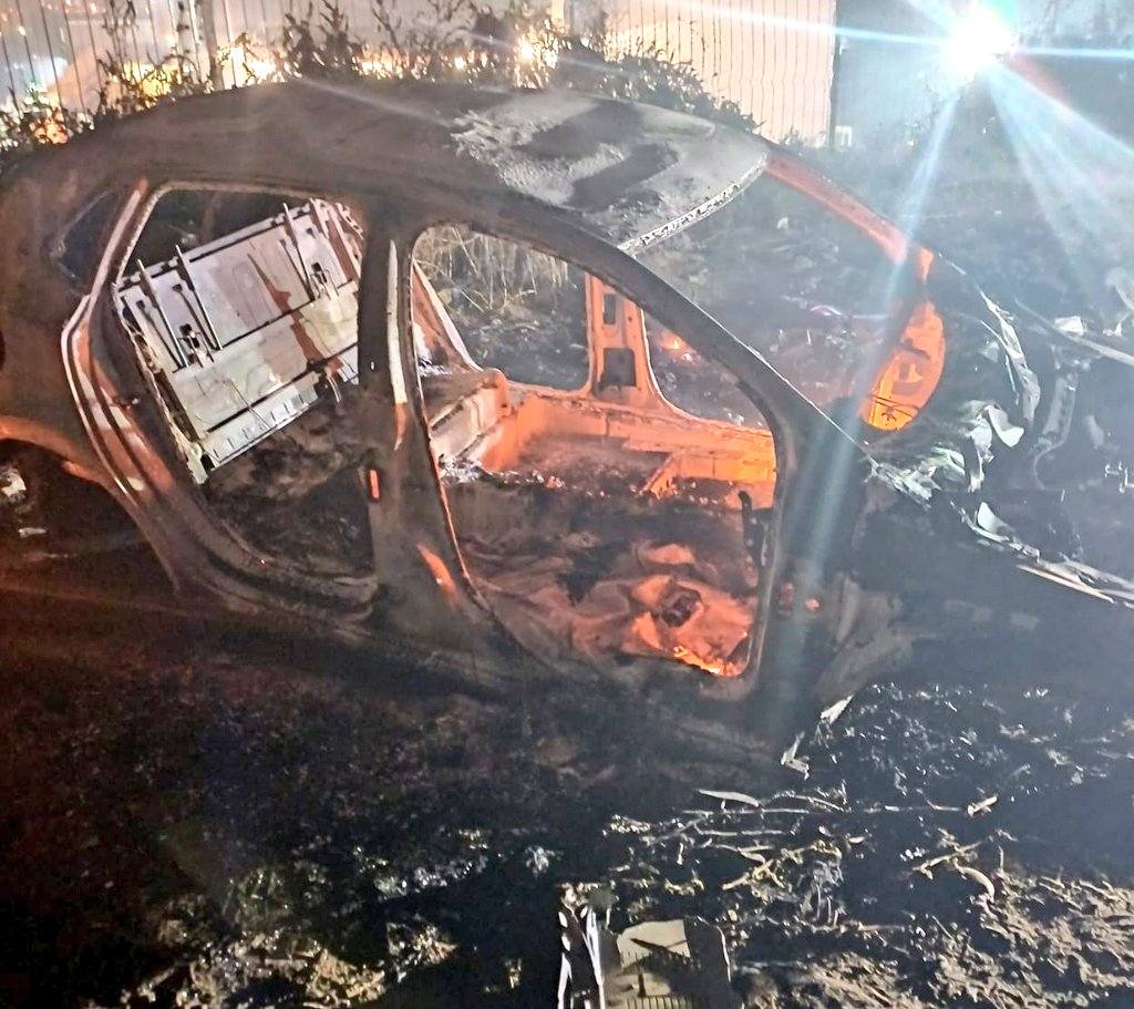 Burned-down shell of a grey VW Polo found on Chris Hani Rd in Pimville