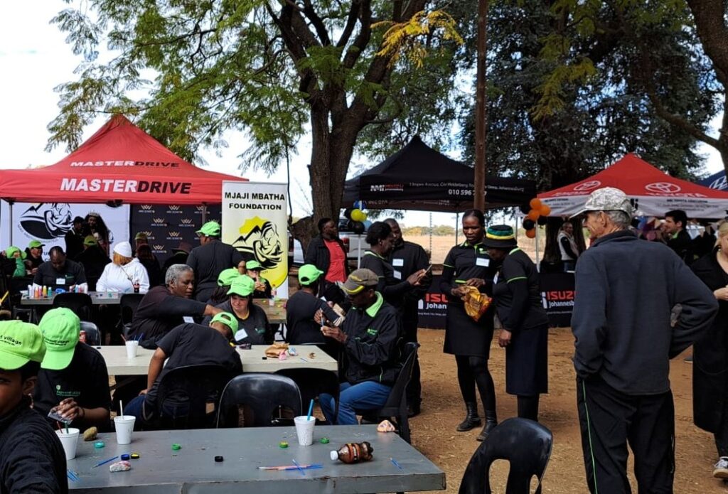 MasterDrive spends time with the residents of Logwood Village on Mandela Day