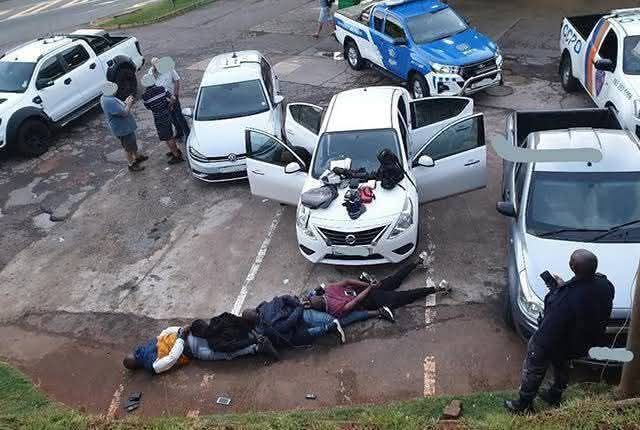 Four taxi drivers have been arrested after violently removing a family of three from their vehicle and taking possession of it