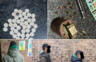 Suspects arrested after being found in possession of a stun grenade and live ammunition