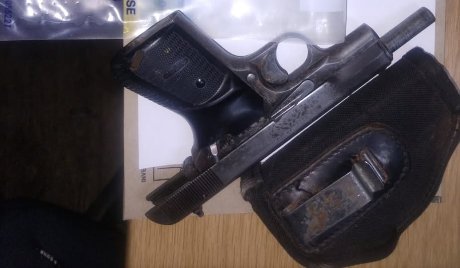 Murder suspect also charged for possession of unlicensed firearm