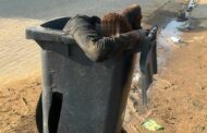 Suspect arrested after he was caught transporting an injured man inside a wheelie bin