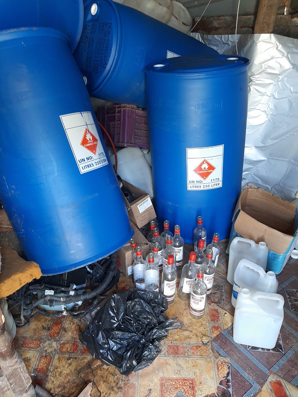 Suspect caught mixing ethanol with water