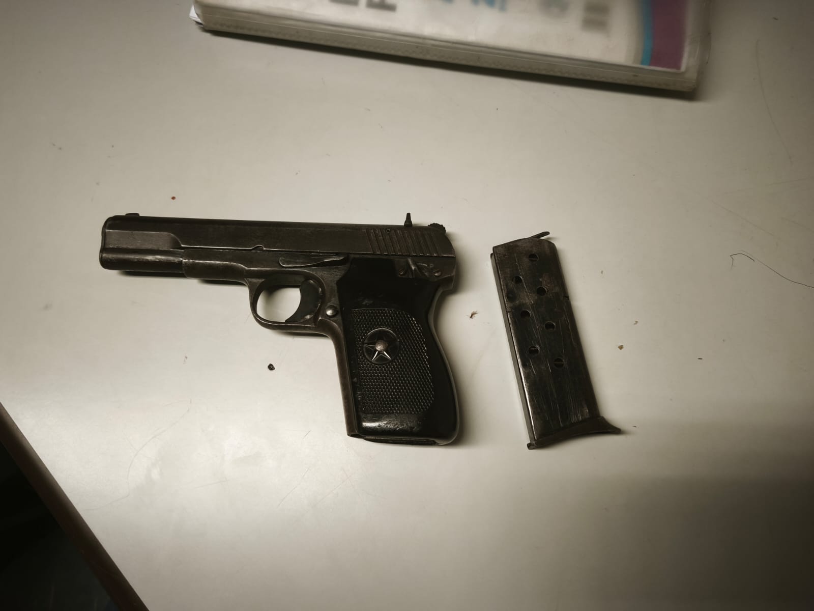 Suspect arrested for possession of an unlicensed 9mm pistol (intact serial number) without ammunition